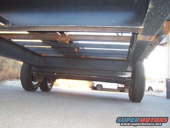 underneath trailer from front. Here you can see the 10" I-beam frame and crossmembers, and all the 3" C-channel crossmembers for the deck.
This is also where the spare tire will go
