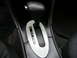 1999 Ford Taurus - Close-up of an automatic transmission gear selector with a carbon fiber trim plate.