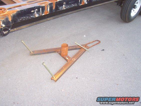 Spare tire cradel. Made from 3" C-channnel, and in a "Y" shape to allow easier reomval of tire. Handle has been extended to allow easier raising and lowering of tire.
