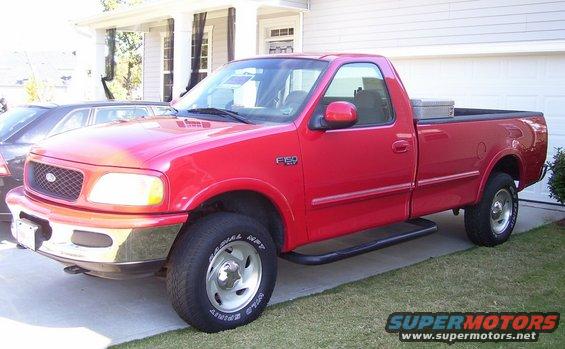 Red 1997 Ford F-150 pickup truck, 3/4 front view