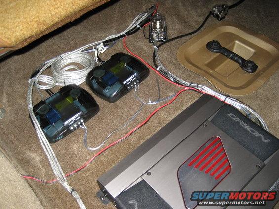 Car audio amplifier and two crossovers wired up on carpeted floor