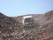 1996 Ford Bronco - A Ford Bronco navigates a steep, rocky incline under a clear blue sky.