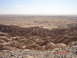 1996 Ford Bronco - A vast desert landscape unfolds under a hazy sky, with terrain in the foreground.