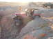 1996 Ford Bronco - Off-roading adventure with a red Jeep Wrangler navigating a challenging course in a desert landscape.