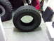 1983 Ferrari Enzo - BFGoodrich All-Terrain T/A tire shown on a concrete floor with other items in the background.