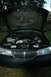 1999 Lincoln Town Car - Front view of a 1999 Lincoln Town Car with the hood open, revealing the engine and a turbocharger.