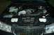 1999 Lincoln Town Car - The engine bay of a 1999 Lincoln Town Car shows a modified engine with a turbocharger and custom intake piping.