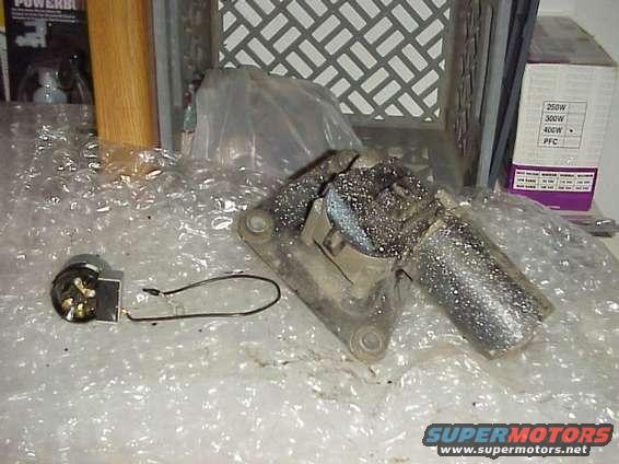 Windshield wiper motor and a small electrical switch with a wire loop