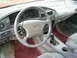1995 Ford Taurus - The interior of a car, the dashboard, steering wheel, and gear shifter. A 'SHO' badge is visible on the dashboard.