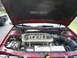 1995 Ford Taurus - Engine bay of a 1995 Ford Taurus SHO, showing the V8 engine and other components under the open hood.
