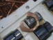 1989 Ford F-350 - A rusty metal piece rests on a socket in a tool organizer. The socket is labeled 24mm.