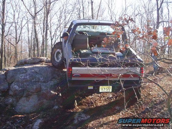 1989 Ford F-350 rear view, off-roading over rocks