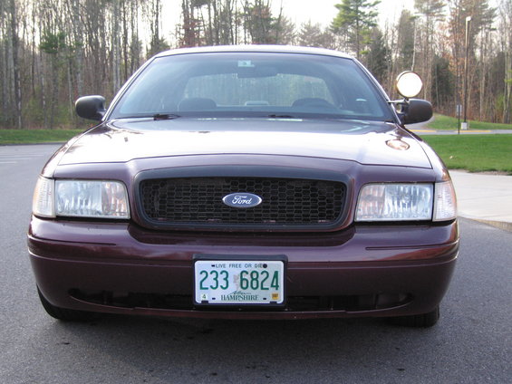 Maroon Ford Crown Victoria front view. License plate reads 233 6824