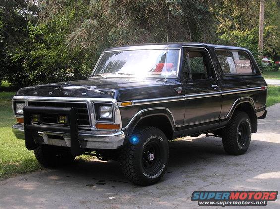 Black 1978 Ford Bronco parked outside, front bull bar with yellow lights