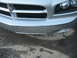2006 Dodge Charger - Front view of a silver 2006 Dodge Charger showing the grille and bumper with some wear and tear.