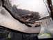 1994 Ford Bronco - Underside view of a vehicle's exhaust system and oil pan, showing signs of wear and potential leaks.