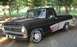 2002 Ford Crown Victoria - Customized Ford F-Series pickup truck with a two-tone paint scheme and aftermarket wheels.