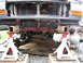 1996 Ford F-250 - Front view of a 1996 Ford F-250 undergoing maintenance, with the front end elevated on jack stands.