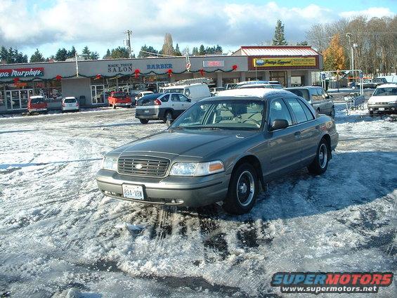 Gray 2000 Ford Crown Victoria front 3/4 view in a snowy parking lot