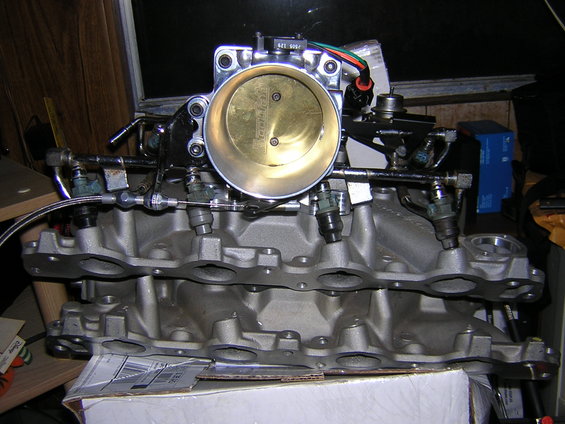 engine intake manifold and throttle body assembly with fuel injectors