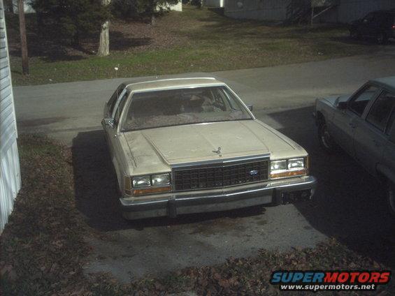 Tan 1985 Ford Crown Victoria LTD parked outside