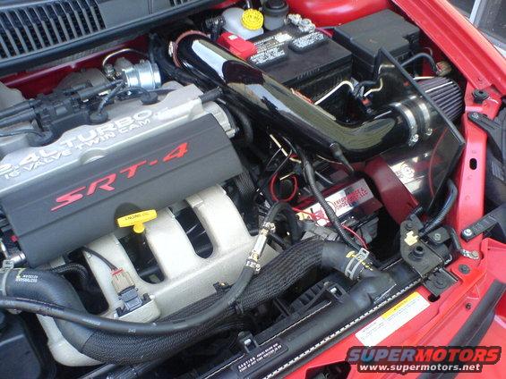 Engine bay with SRT-4 turbo engine, custom intake, and battery