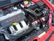 2005 Dodge SRT-4 - Close-up of the engine bay, highlighting the SRT-4 turbo engine and aftermarket intake system.