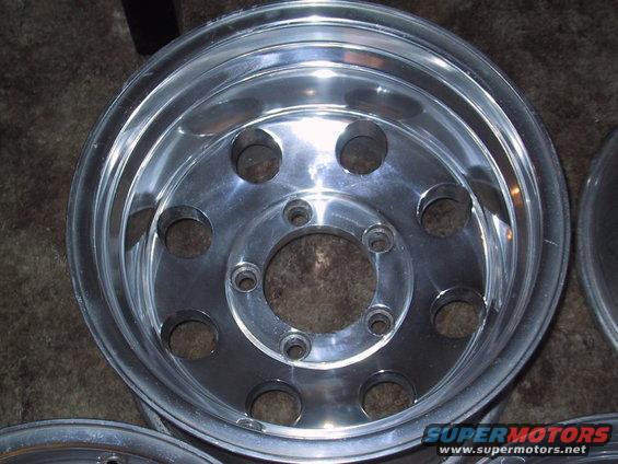 Close-up of a single aluminum wheel with 8 lug holes