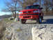 2001 Mazda B3000 - A red 2001 Mazda B3000 pickup truck is parked outdoors on a sunny day.