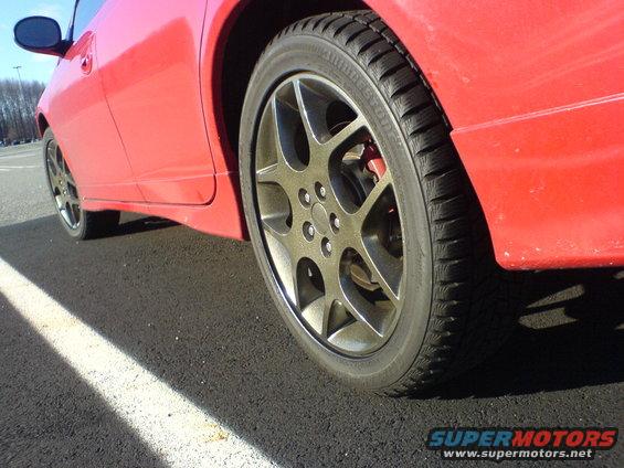 Red 2005 Dodge SRT-4 side profile showing front wheel and fender