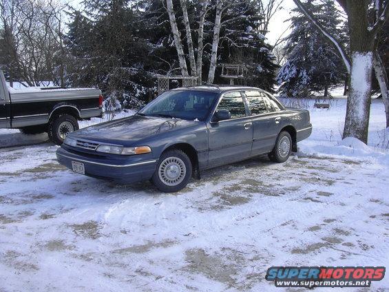 Dark blue 1995 Ford Crown Victoria parked in snow, 3q-front view