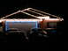 1997 Ford Probe - Several cars are parked in a driveway at night, illuminated by the glow of Christmas lights decorating the house.