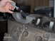 1978 Ford Bronco - Applying assembly lube to main bearing caps before installation on engine block.