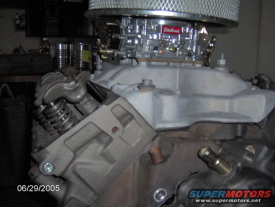 close-up of engine block with Edelbrock carburetor and air filter