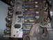 1978 Ford Bronco - Close-up view of an engine block, showing the intake manifold gasket and pushrods.