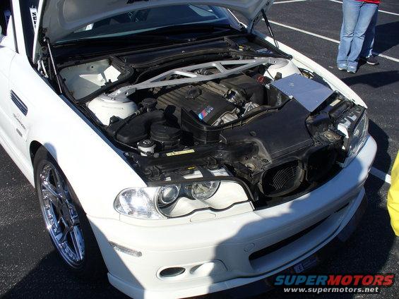 White BMW M3 engine bay with "M" badge visible