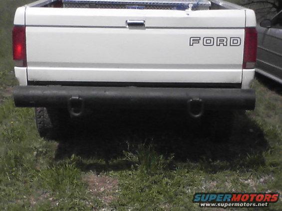 White Ford F-Series truck rear view with black bumper and Ford badging