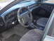 1993 Mitsubishi Diamante - Interior view of a car, a camouflage steering wheel cover and a prominent SuperMotors watermark on the dashboard.
