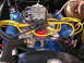 1979 Ford F-250 - The engine bay features a V8 engine with prominent yellow spark plug wires and a red distributor cap.