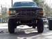 1988 Ford Bronco - This Ford truck features a heavy-duty aftermarket bumper and off-road tires, suggesting it's modified for use.