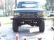1988 Ford Bronco - This Ford F-Series truck features a custom front bumper and off-road tires, with 'ANDREWS' visible on the windshield.
