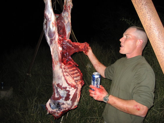 Man with carcass and beer can