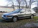 1993 Mitsubishi Diamante - A 1993 Mitsubishi Diamante station wagon is parked outdoors on a gravelly lot with fallen leaves.