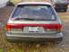 1993 Mitsubishi Diamante - The rear of a Mitsubishi Diamante wagon is shown, with a Jeep Cherokee visible in the background.