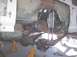 1988 Ford Bronco - Custom suspension components are visible on a vehicle frame supported by jack stands.
