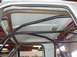 1988 Ford Bronco - Custom roll cage installed inside a white vehicle's cabin.