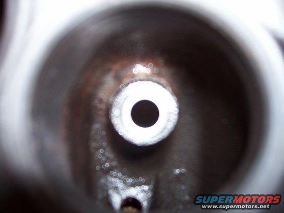 Close-up of a valve stem seal with a central hole