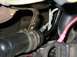 2000 Ford Taurus - Here you can see part of the short rubber hose that couples the rad. steel lines to the tranny steel lines.