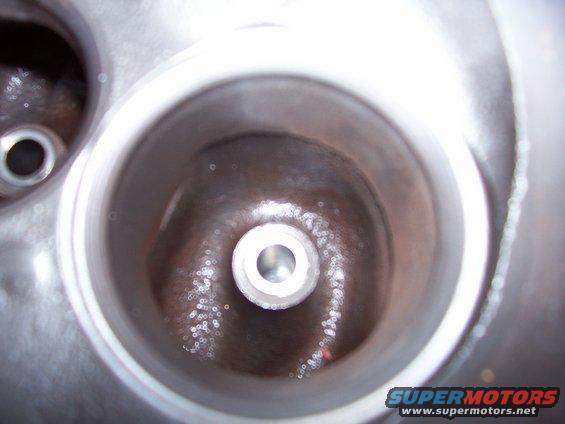 Close-up of an engine cylinder head with two combustion chambers visible
