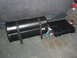 1989 Ford Bronco - Car audio system components, including a subwoofer and amplifier, are secured in the back of a vehicle.